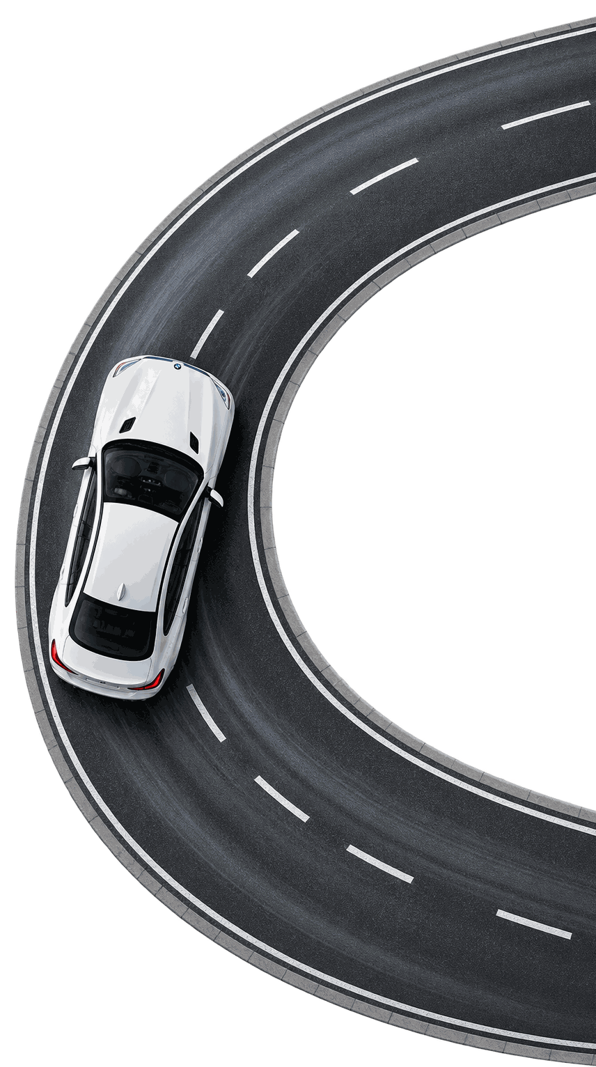 Top view of a white BMW driving on a curved road, representing European auto service in Wyckoff, NJ